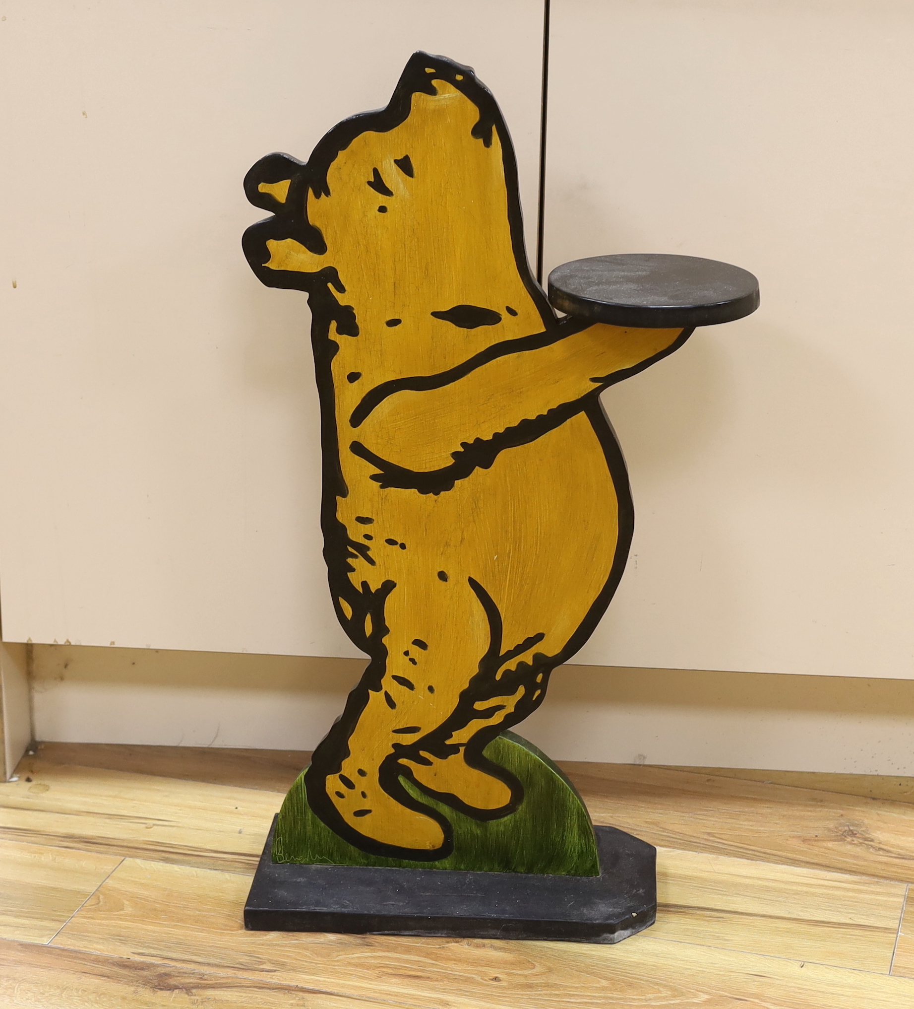 A Winnie the Pooh painted dumb waiter, 75cm high